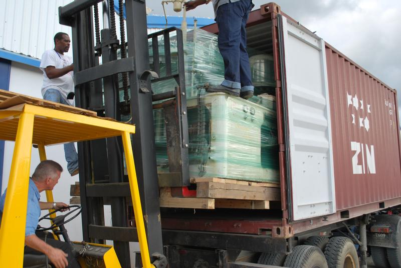 Cargo Being Lifted Into the Container by Forklift